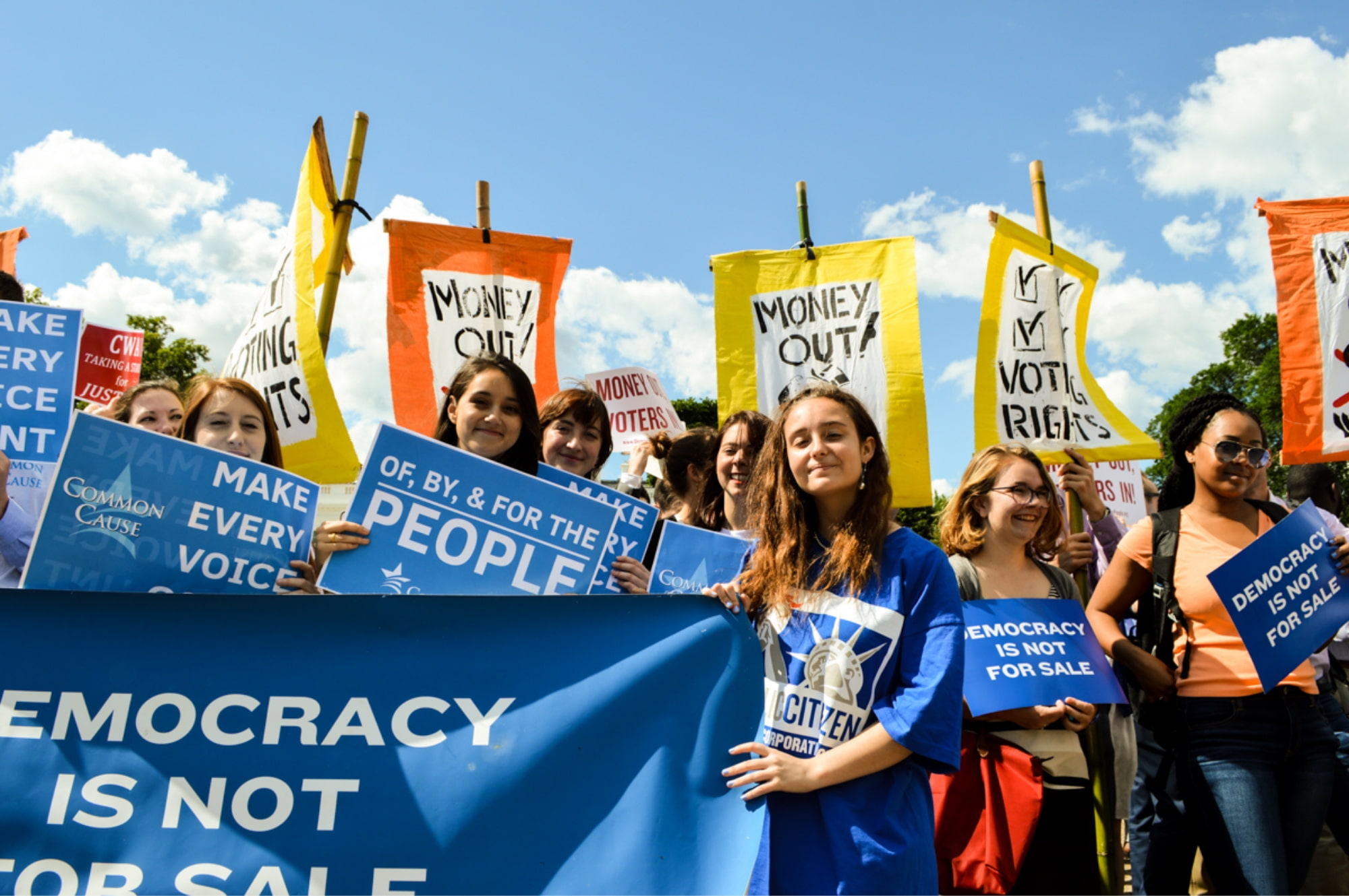 Image of young activists at a rally for driving money out of politics